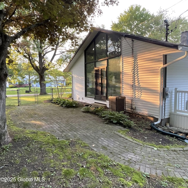 129 Okara Dr, Guilderland, NY 12303 - view of property exterior with central air condition unit and a gate