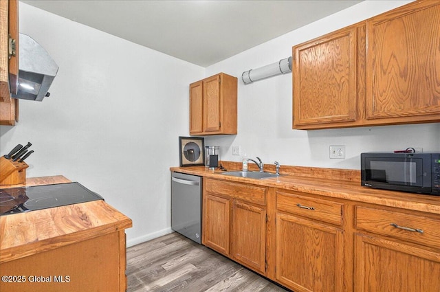 60 Tallow Wood Dr, Clifton Park, NY 12065 - kitchen with black microwave, stainless steel dishwasher, a sink, and brown cabinetry
