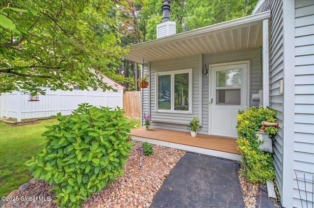 60 Tallow Wood Dr, Clifton Park, NY 12065 - view of exterior entry with a chimney and a porch