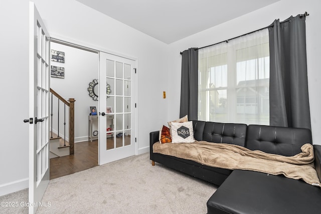 2 Hillard Ln, Colonie, NY 12110 - living area featuring french doors, carpet, stairs, and baseboards
