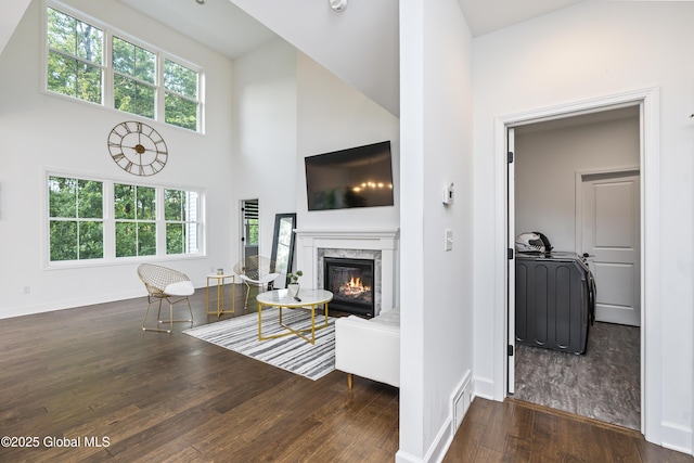 2 Hillard Ln, Colonie, NY 12110 - living area with wood finished floors, a premium fireplace, a high ceiling, and baseboards