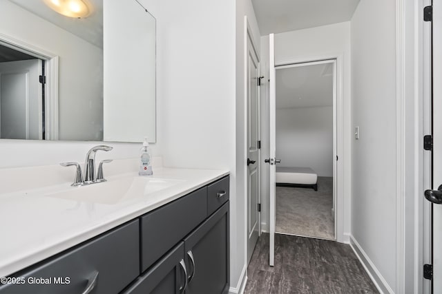 2 Hillard Ln, Colonie, NY 12110 - bathroom featuring vanity, wood finished floors, and baseboards