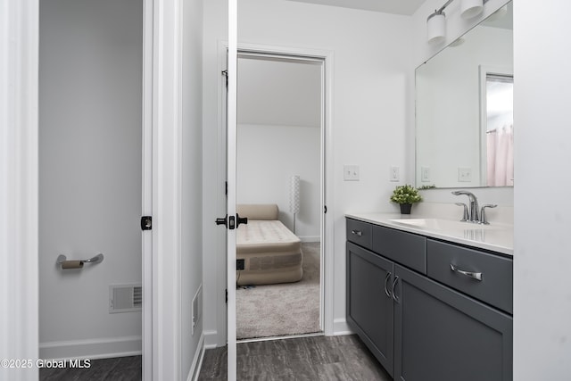 2 Hillard Ln, Colonie, NY 12110 - bathroom with vanity, baseboards, and wood finished floors