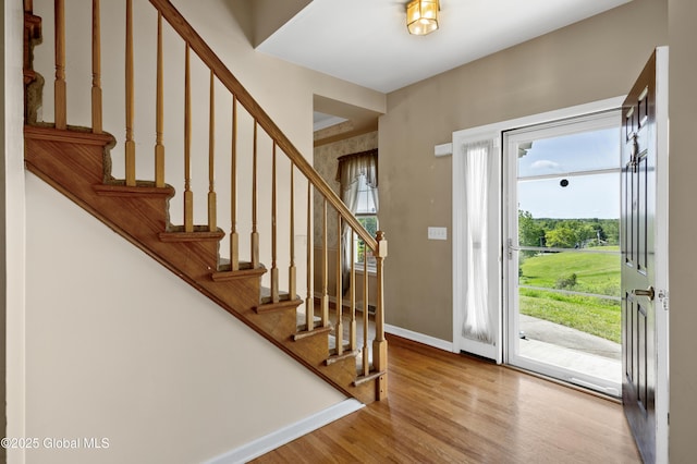 3119 State Route 150, Schodack, NY 12063 - entrance foyer featuring healthy amount of natural light, wood finished floors, and stairs