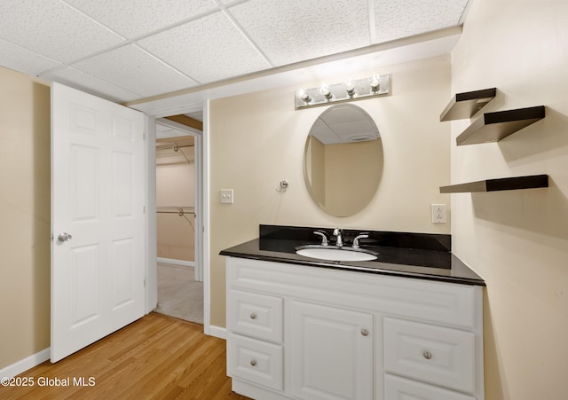 3119 State Route 150, Schodack, NY 12063 - bathroom featuring vanity, wood finished floors, baseboards, and a paneled ceiling