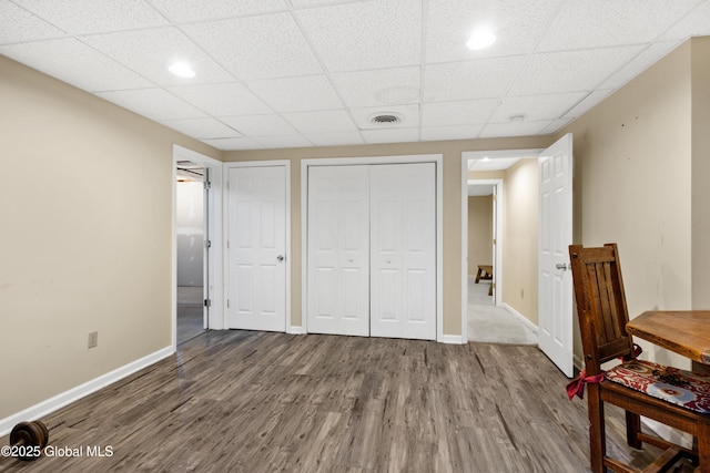 3119 State Route 150, Schodack, NY 12063 - unfurnished bedroom with wood finished floors, baseboards, a drop ceiling, a closet, and recessed lighting