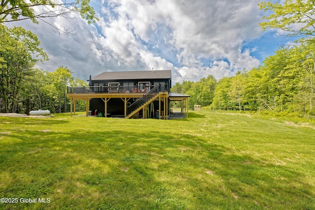 17 Ringwald Rd, Coeymans, NY 12046 - rear view of property with a wooden deck, a lawn, stairway, and a view of trees