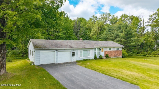 149 Wilton Rd, Greenfield, NY 12833 - ranch-style home featuring a garage, asphalt driveway, a front yard, and a chimney