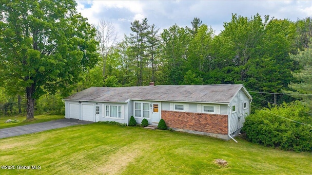149 Wilton Rd, Greenfield, NY 12833 - ranch-style home featuring brick siding, asphalt driveway, a front yard, and an attached garage
