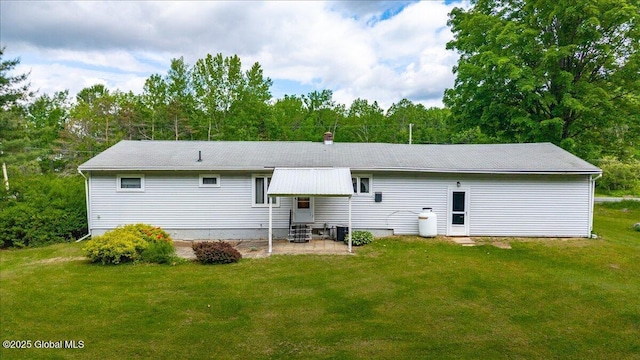 149 Wilton Rd, Greenfield, NY 12833 - back of house featuring entry steps, a lawn, a patio area, and central air condition unit