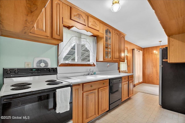 149 Wilton Rd, Greenfield, NY 12833 - kitchen with electric range oven, black dishwasher, light countertops, glass insert cabinets, and brown cabinetry