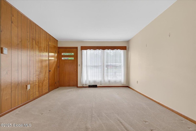 149 Wilton Rd, Greenfield, NY 12833 - unfurnished room with carpet, wood walls, and baseboards