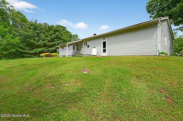149 Wilton Rd, Greenfield, NY 12833 - rear view of house with a lawn