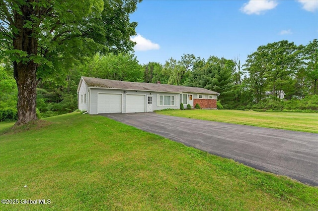 149 Wilton Rd, Greenfield, NY 12833 - single story home featuring a garage, asphalt driveway, and a front lawn