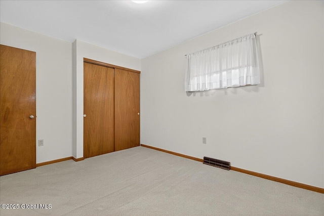 149 Wilton Rd, Greenfield, NY 12833 - unfurnished bedroom with carpet, a closet, and baseboards