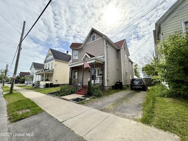 243 N Perry St, Johnstown, NY 12095 - view of front of house featuring covered porch and driveway