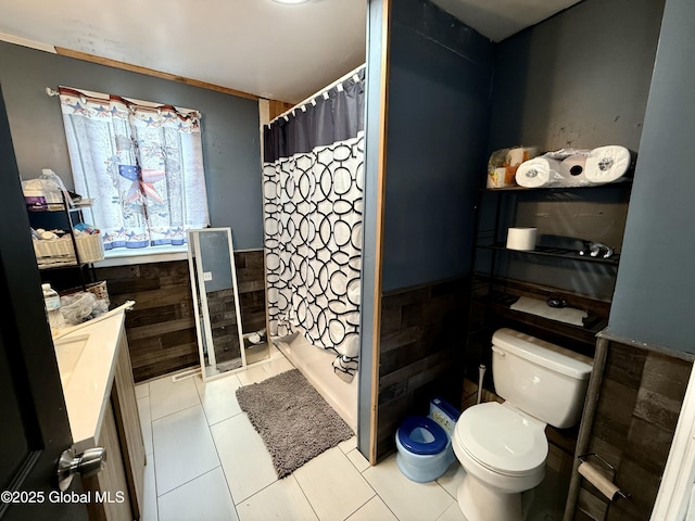 243 N Perry St, Johnstown, NY 12095 - bathroom featuring toilet, a wainscoted wall, vanity, curtained shower, and tile walls