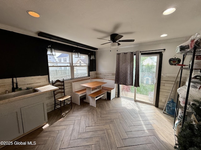 243 N Perry St, Johnstown, NY 12095 - dining room featuring ornamental molding, a ceiling fan, recessed lighting, and wainscoting