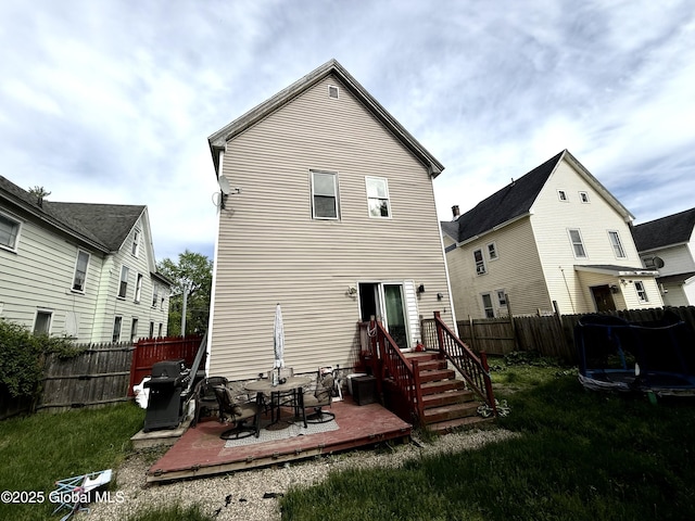 243 N Perry St, Johnstown, NY 12095 - rear view of house featuring a deck