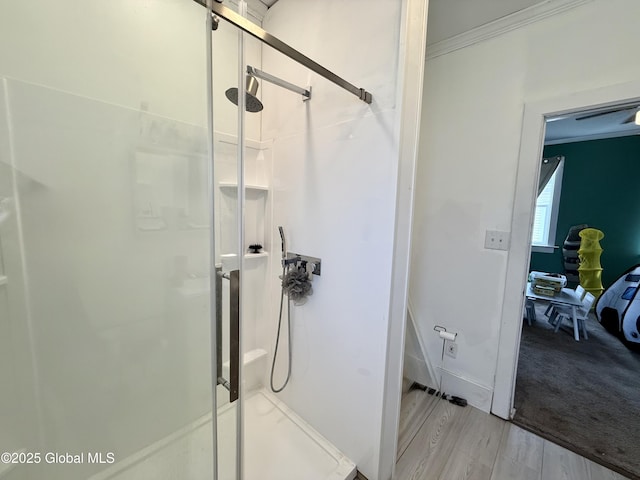 243 N Perry St, Johnstown, NY 12095 - ensuite bathroom with a shower stall, wood finished floors, crown molding, and baseboards