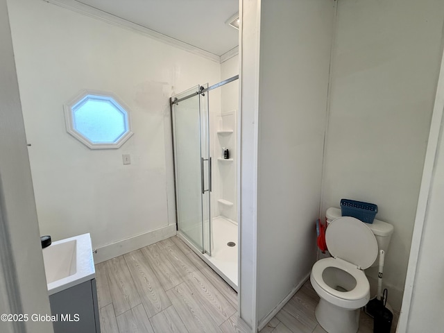 243 N Perry St, Johnstown, NY 12095 - full bath with toilet, vanity, a stall shower, wood finished floors, and ornamental molding