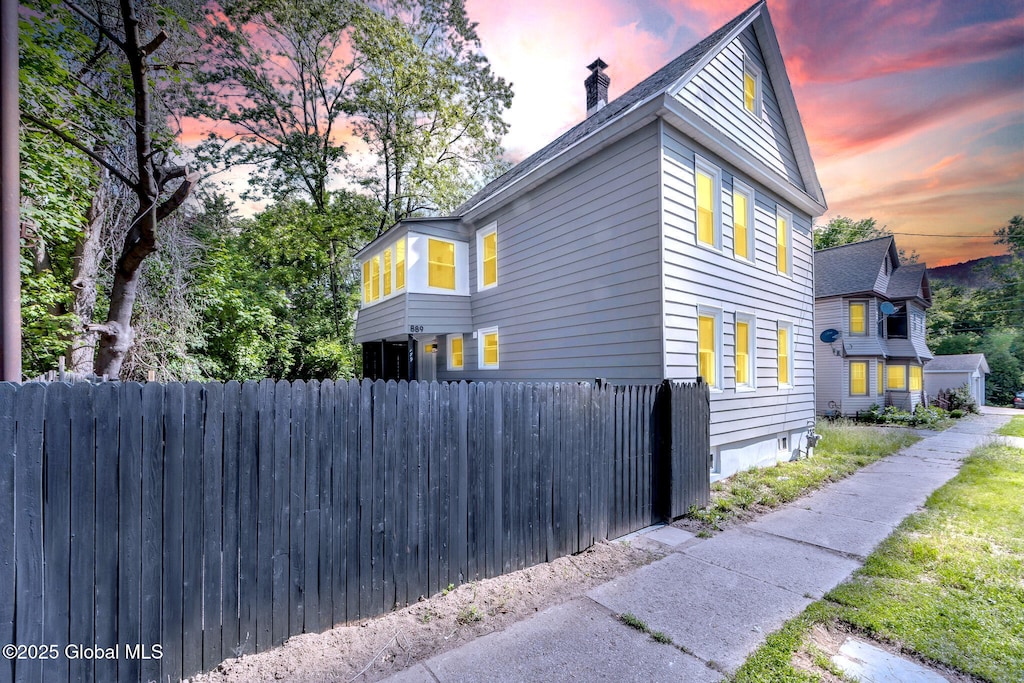 889 Yorkston St, Schenectady, NY 12303 - view of side of home featuring a chimney