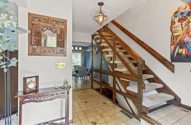 7 Hawthorn Cir, Albany, NY 12203 - stairway with tile patterned floors and a textured ceiling