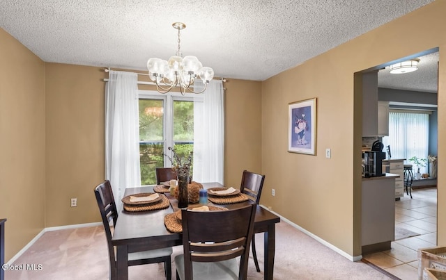 7 Hawthorn Cir, Albany, NY 12203 - dining room featuring a chandelier, a textured ceiling, and light carpet