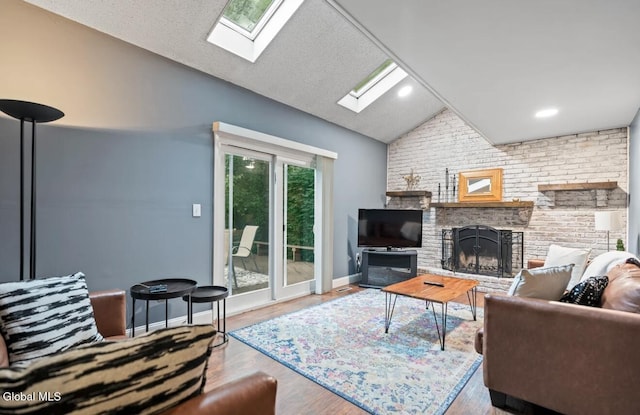 7 Hawthorn Cir, Albany, NY 12203 - living room with a skylight, vaulted ceiling, a brick fireplace, and wood finished floors