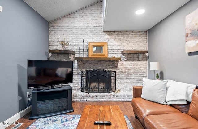 7 Hawthorn Cir, Albany, NY 12203 - living area featuring lofted ceiling, a fireplace, and wood finished floors