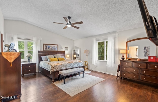 7 Hawthorn Cir, Albany, NY 12203 - bedroom featuring multiple windows, lofted ceiling, dark wood-style floors, a textured ceiling, and ceiling fan