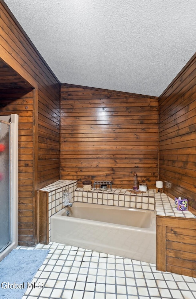 7 Hawthorn Cir, Albany, NY 12203 - full bath with wood walls, a textured ceiling, a garden tub, and tile patterned flooring