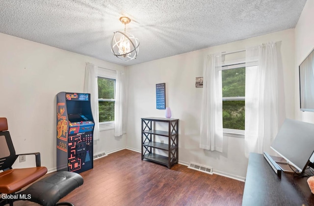 7 Hawthorn Cir, Albany, NY 12203 - sitting room with a chandelier, dark wood-style flooring, and a textured ceiling
