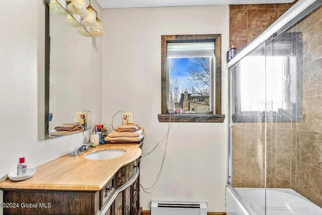 167 Botti Dr, Hunter, NY 12442 - full bath featuring a baseboard radiator, vanity, and bath / shower combo with glass door