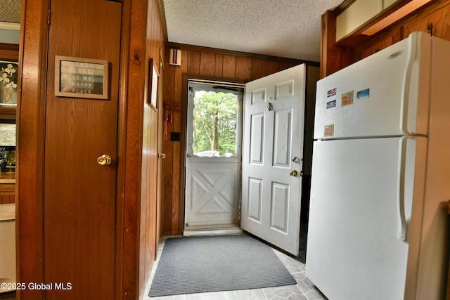 202 Lakeland Rd, Edinburg, NY 12835 - doorway to outside with wooden walls and a textured ceiling