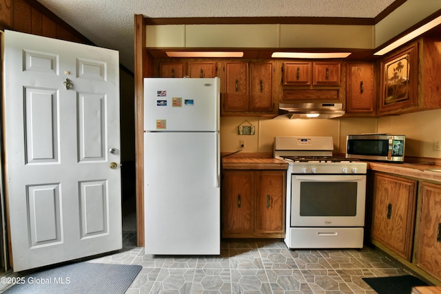 202 Lakeland Rd, Edinburg, NY 12835 - kitchen with white appliances, under cabinet range hood, brown cabinetry, and a textured ceiling