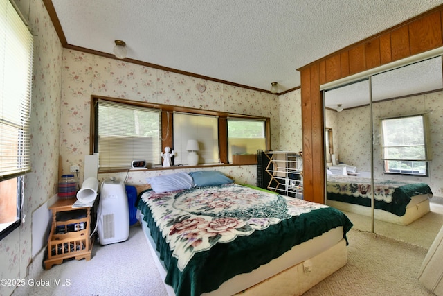 202 Lakeland Rd, Edinburg, NY 12835 - carpeted bedroom with wallpapered walls, crown molding, and a closet