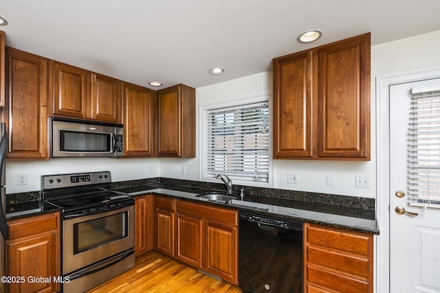 1112 Western Ave Unit 3, Albany, NY 12203 - kitchen featuring appliances with stainless steel finishes, a sink, plenty of natural light, recessed lighting, and light wood finished floors
