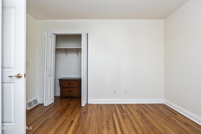 1112 Western Ave Unit 3, Albany, NY 12203 - unfurnished bedroom with wood finished floors, baseboards, and a closet