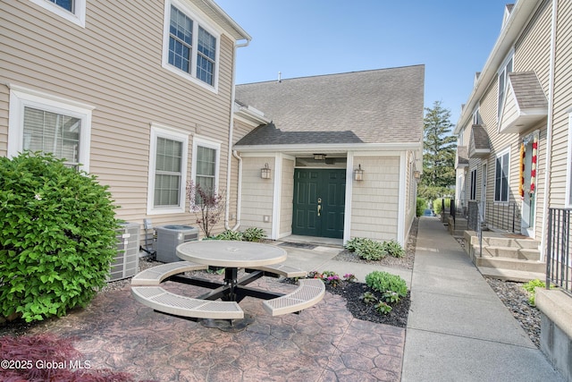 1112 Western Ave Unit 3, Albany, NY 12203 - entrance to property featuring central AC and roof with shingles