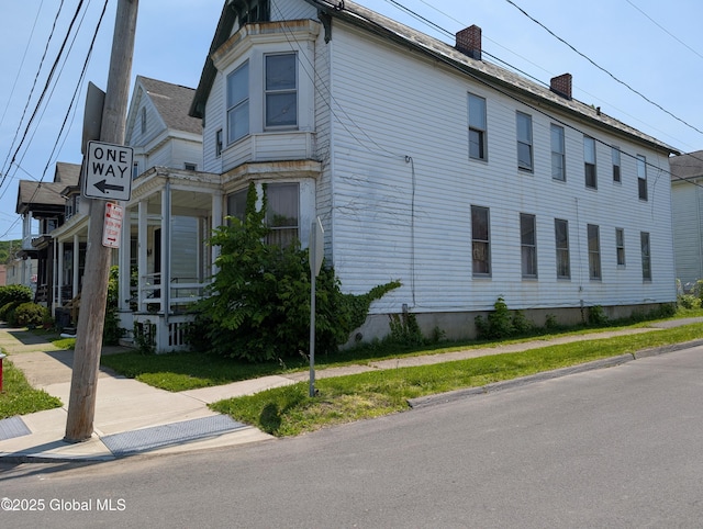 6 123rd St, Troy, NY 12182 - view of side of property with a chimney