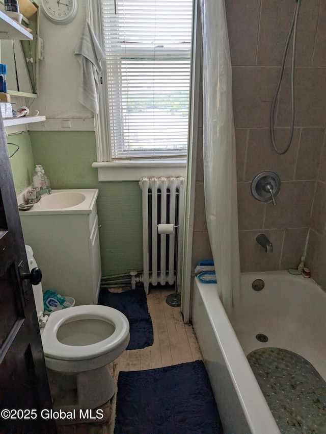 6 123rd St, Troy, NY 12182 - full bathroom with radiator heating unit, shower / tub combo, vanity, and wood finished floors