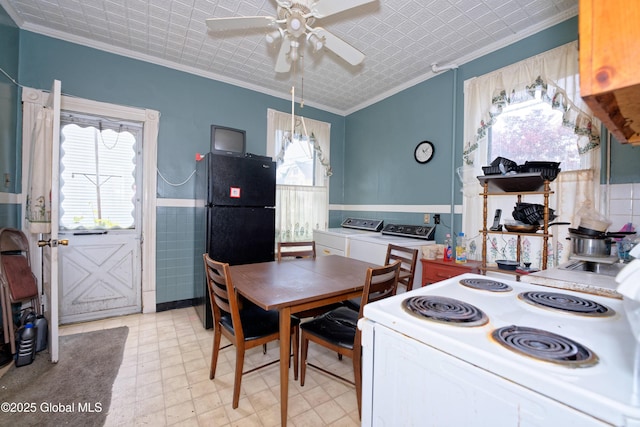 6 123rd St, Troy, NY 12182 - dining area with crown molding, ceiling fan, washing machine and dryer, light floors, and a wainscoted wall