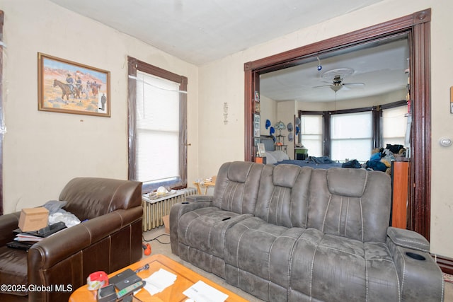 6 123rd St, Troy, NY 12182 - living area featuring a ceiling fan and radiator heating unit
