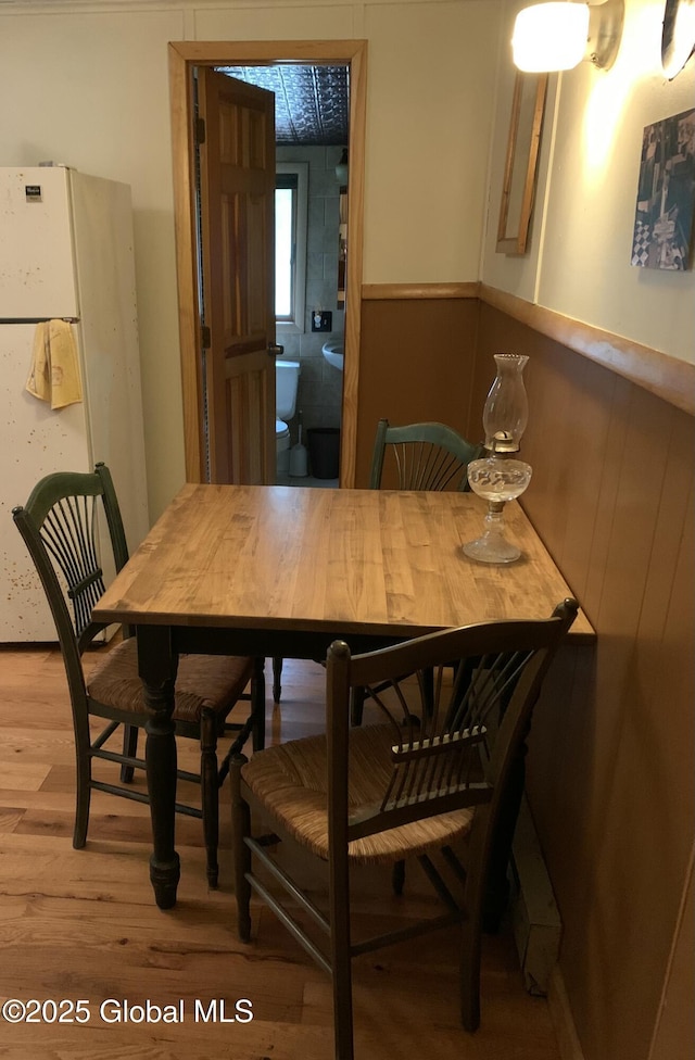 847 Lake Ave, Lake Luzerne, NY 12846 - dining area featuring a wainscoted wall and light wood-style flooring