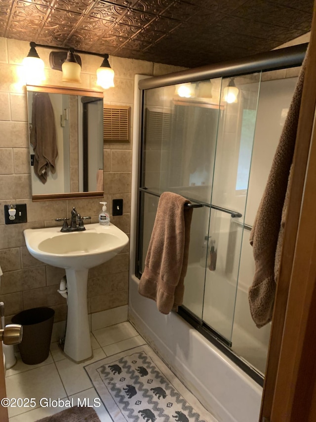 847 Lake Ave, Lake Luzerne, NY 12846 - full bathroom featuring tile walls, an ornate ceiling, bath / shower combo with glass door, tile patterned floors, and decorative backsplash
