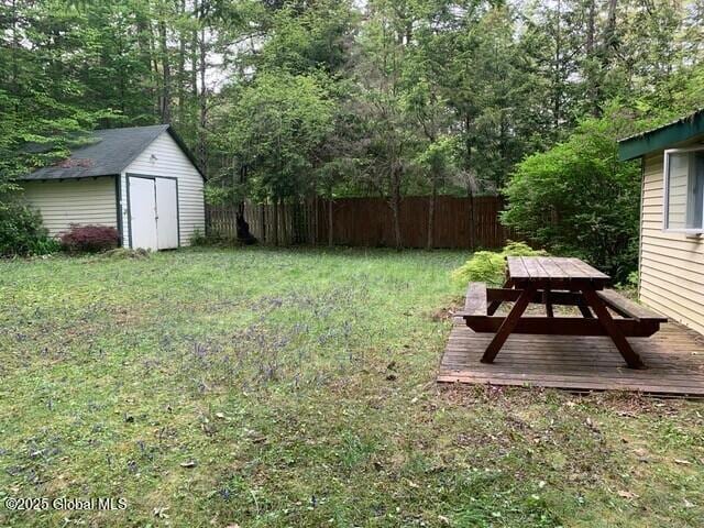 847 Lake Ave, Lake Luzerne, NY 12846 - view of yard featuring a storage shed, outdoor dining space, and a deck