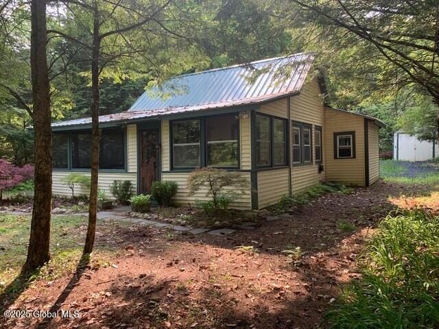 847 Lake Ave, Lake Luzerne, NY 12846 - view of front of property with a sunroom and a metal roof