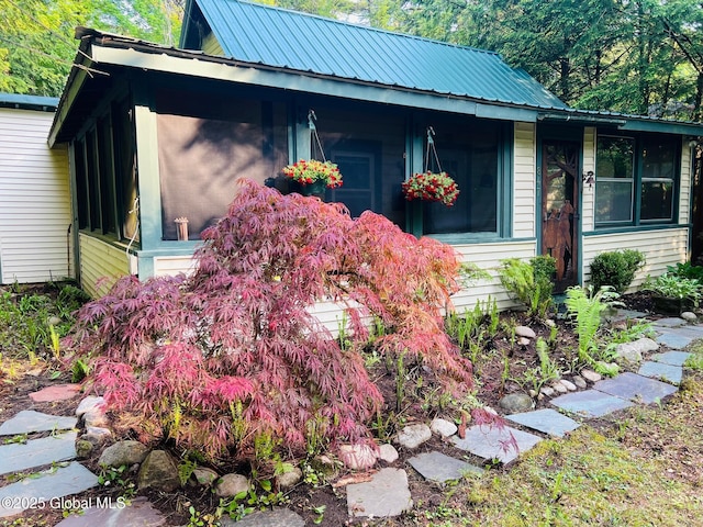 847 Lake Ave, Lake Luzerne, NY 12846 - view of property exterior with a metal roof and a sunroom