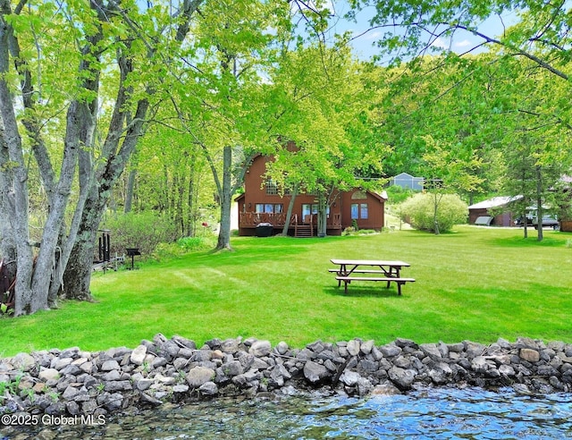 2555 County Highway 22, Exeter, NY 13315 - view of property's community with a lawn and a wooden deck